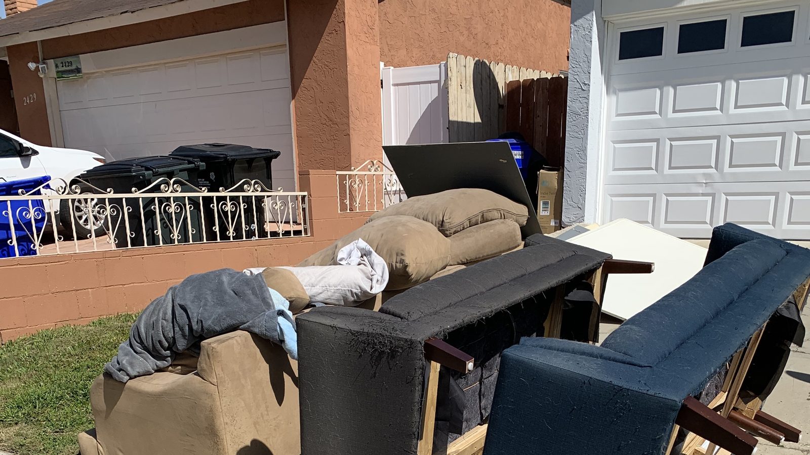 Sofas staged for a Fred's Junk Removal pickup